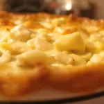 Close-up of a chicken pot pie with a golden crust, topped with creamy chicken and potato filling. discover Why Did My Chicken Pot Pie Come Out Watery