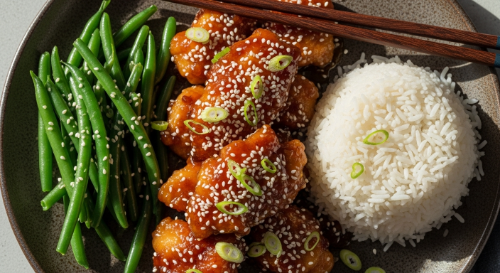 Plated Air Fryer Honey Garlic Chicken with rice and green beans