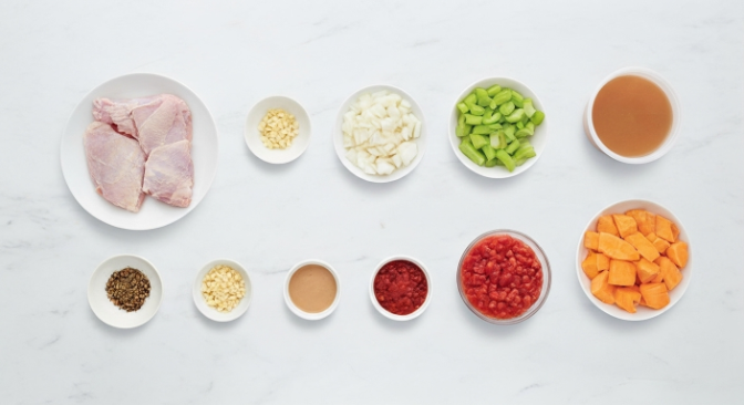 Ingredients for Slow Cooker Chicken and Sweet Potato Stew arranged on a counter
