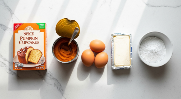 Flat lay ingredients for 5-Ingredient Pumpkin Cupcakes on a quartz counter