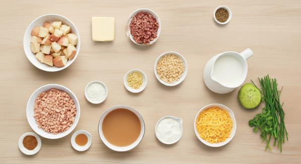 Ingredients for Loaded Baked Potato Soup arranged as a flat lay