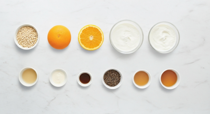 Ingredients for Orange Creamsicle Overnight Oats arranged on a board