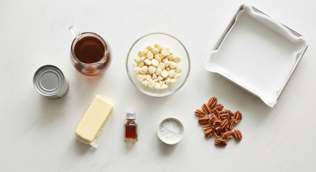 o ingredients for maple pecan fudge squares flat lay on counter