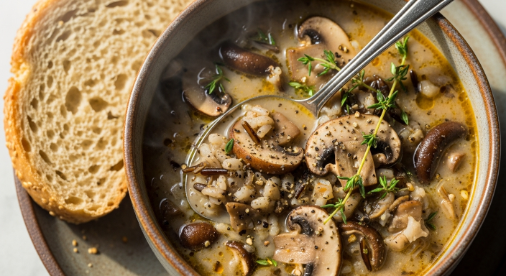 Final bowl of mushroom and wild rice soup with herbs