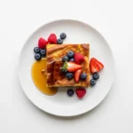 Plated square of baked French toast casserole