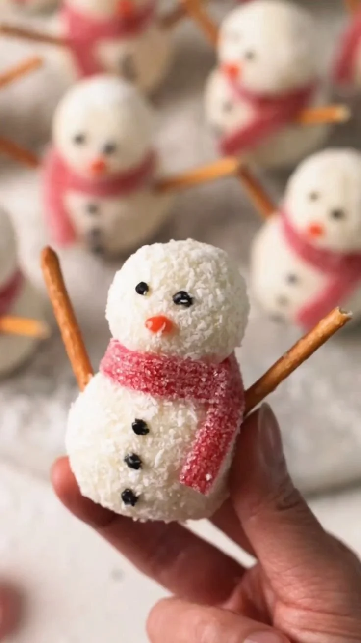 Cute snowmen truffles decorated for the holidays, perfect no-bake treat.