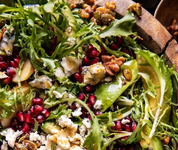Festive Christmas salad with honey mustard dressing served in a bowl