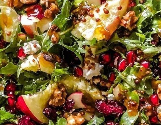 Festive Christmas salad with honey mustard dressing and colorful veggies.