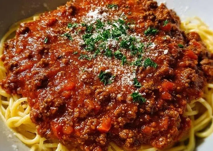 Authentic 130-year-old Italian spaghetti sauce served on pasta.