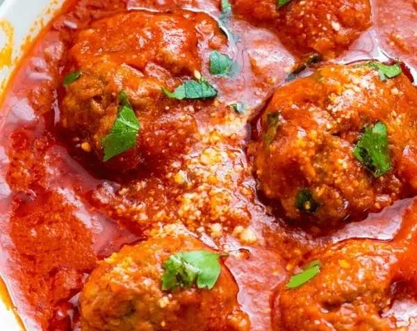Plate of authentic homemade Italian meatballs in tomato sauce