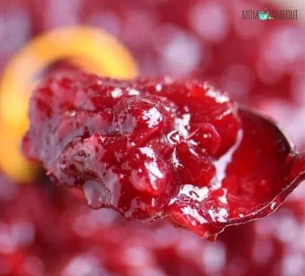 Best Ever Cranberry Sauce served in a bowl with a spoon