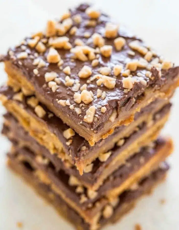Delicious homemade Graham Cracker Toffee Bars topped with chocolate and nuts.