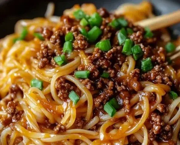 Mongolian Ground Beef Noodles served in a bowl with fresh vegetables