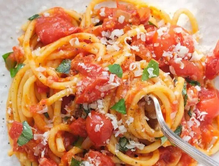 A plate of Neapolitan Pasta showcasing vibrant ingredients and classic preparation.