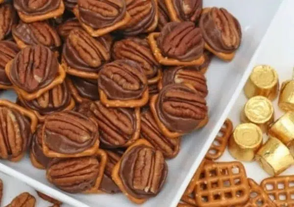 Delicious Rolo Pretzel Bites topped with chocolate and caramel