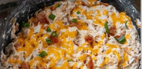 Creamy Crockpot Crack Chicken served in a bowl with herbs